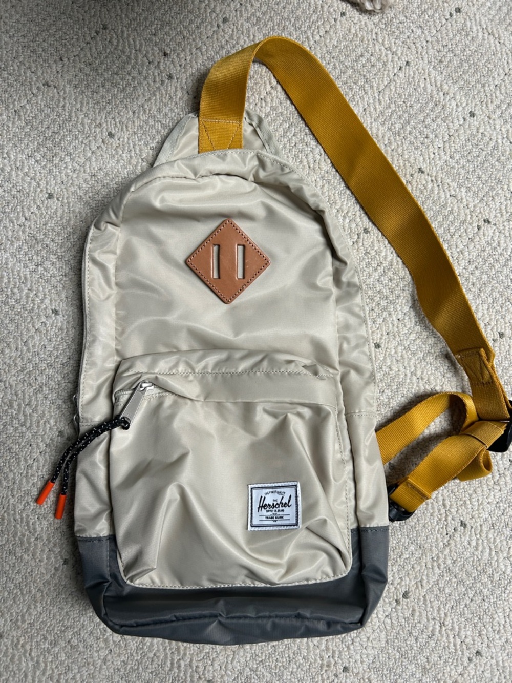Herschel Supply Company beige sling bag with mustard strap